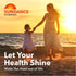 A mother and young daughter walk hand-in-hand on a sandy beach during sunset by the ocean, promoting Magnesium.
