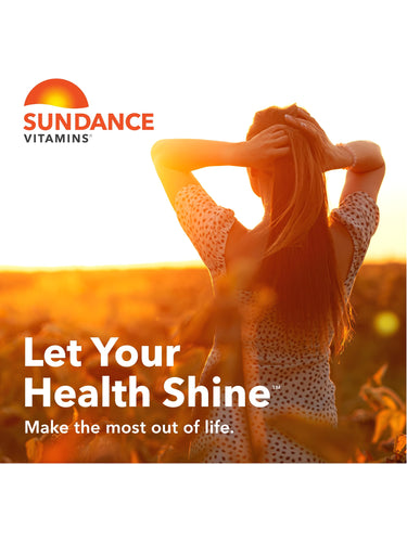 Young adult woman with hands in her hair enjoys a bright sunset in a field, representing Hair, Skin, Nails.