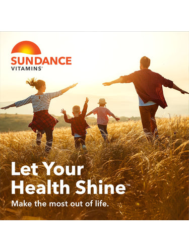 Family of four—man, woman, boy, and girl—running joyfully through a sunny field with outstretched arms.
