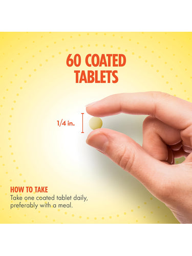 A quarter-inch long, light yellow tablet held between fingers.