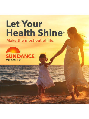Woman and young girl walk hand-in-hand on a sandy beach at sunset, with 'Sundance Vitamins' logo visible.