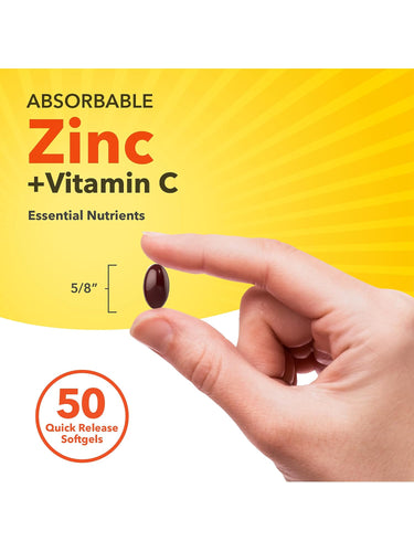 A hand holds a Zinc + Vitamin C softgel, 5/8 inch in size, with a bottle labeled '50 Quick Release Softgels' in the background.