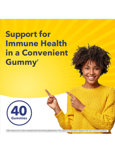 A young Black woman smiles and points at text promoting immune health and 40 Zinc Gummies.