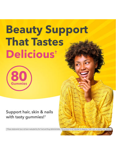 A smiling young Black woman with curly hair stands next to text promoting Hair, Skin & Nails 80 Gummies.