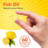 A hand holds a 1-inch Fish Oil Natural Lemon Flavor softgel, showcasing its size for scale.