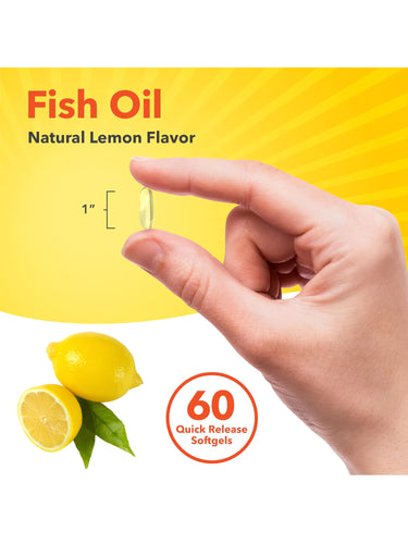 A hand holds a 1-inch Fish Oil Natural Lemon Flavor softgel, showcasing its size for scale.