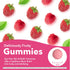 Deliciously Fruity Hair, Skin & Nails Gummies. Raspberry flavored gummy, 3/4 inch diameter, on a background of fresh raspberries.