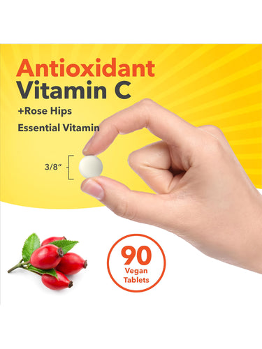 Antioxidant Vitamin C +Rose Hips 90 Vegan Tablets. Essential Vitamin. White 3/8-inch tablet held in a hand.
