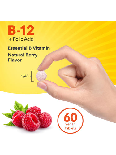 A vegan tablet of B-12 + Folic Acid in natural berry flavor, measuring 1/4 inch, held between two fingers.